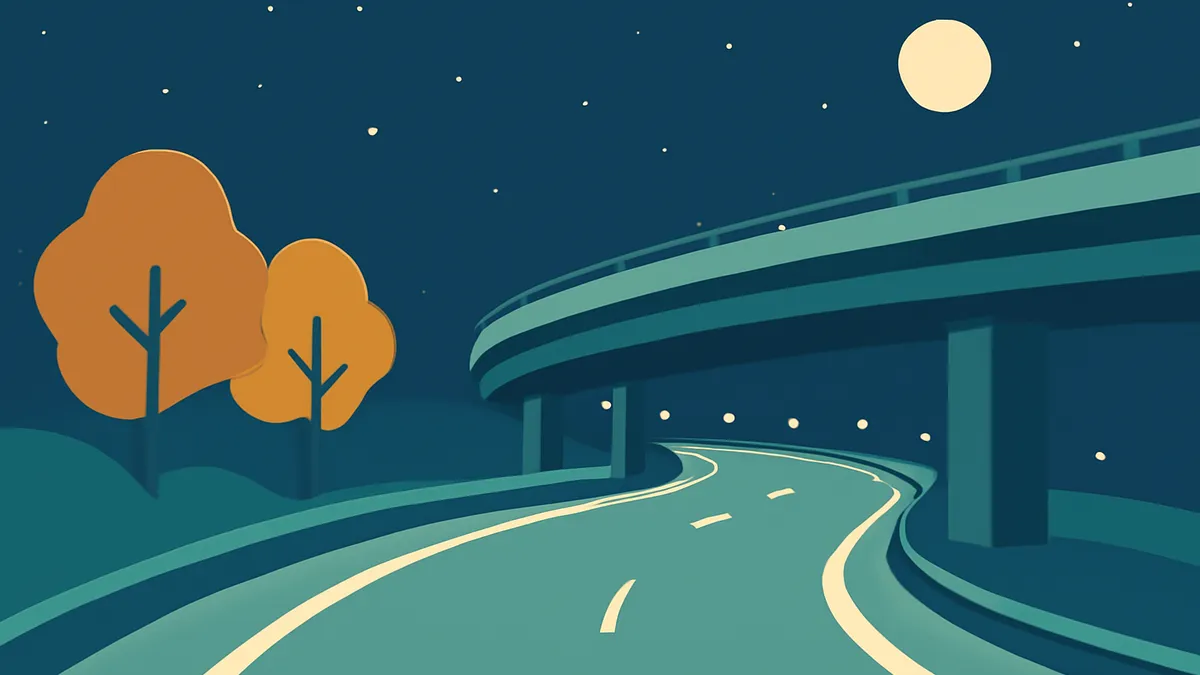 A winding highway under an overpass at night, with two trees on a hill and a full moon in the sky