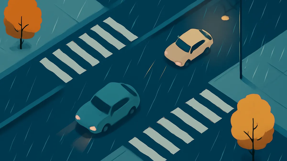 Two cars on a rainy street with crosswalks and trees under a street light at night