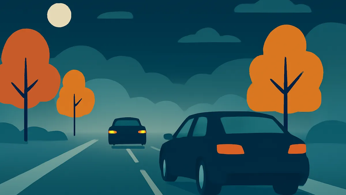 Two cars driving on a road at night with orange trees and a full moon in the sky