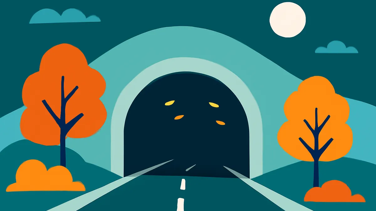 A road leading into a tunnel at night, flanked by orange trees and bushes under a full moon