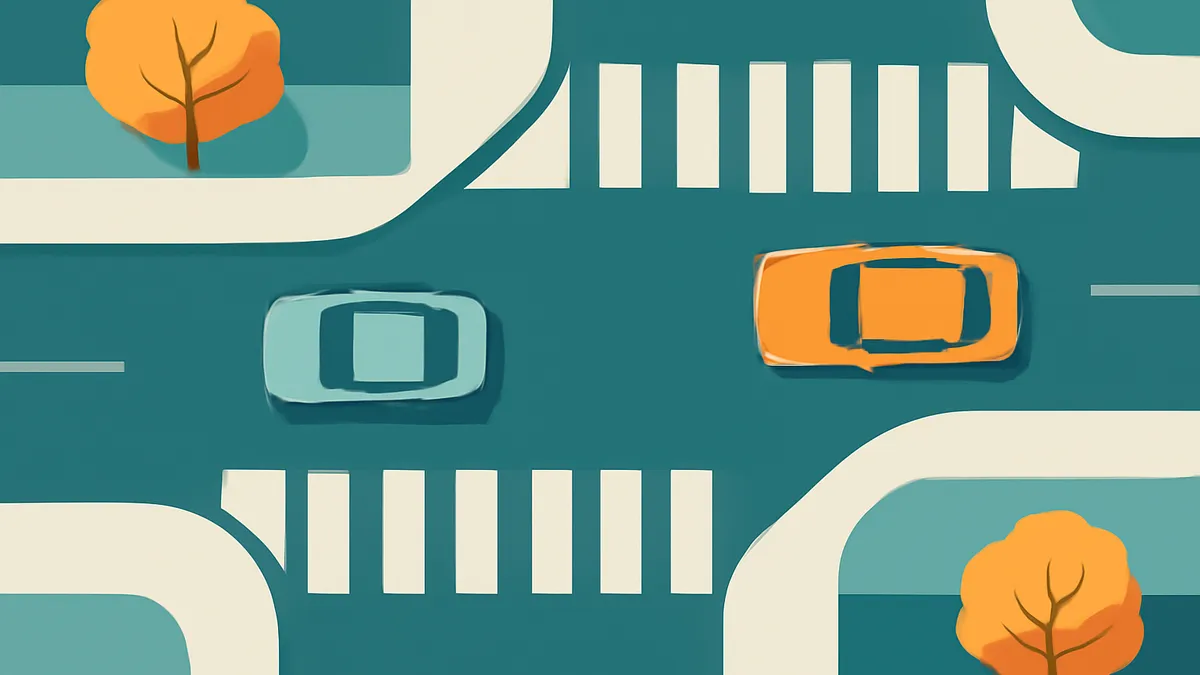 An overhead view of two cars, one orange and one teal, driving on a teal road with white crosswalks and two orange trees