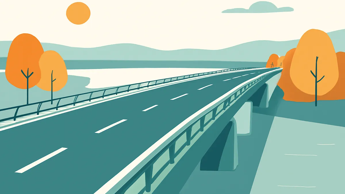 A highway bridge over water with trees and mountains in the background under a sunny sky