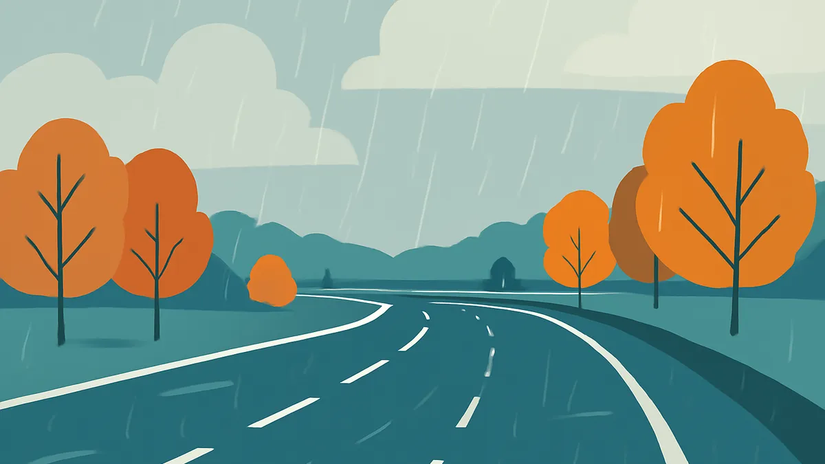 A two-lane highway curves through a landscape with orange trees and green hills under a rainy sky