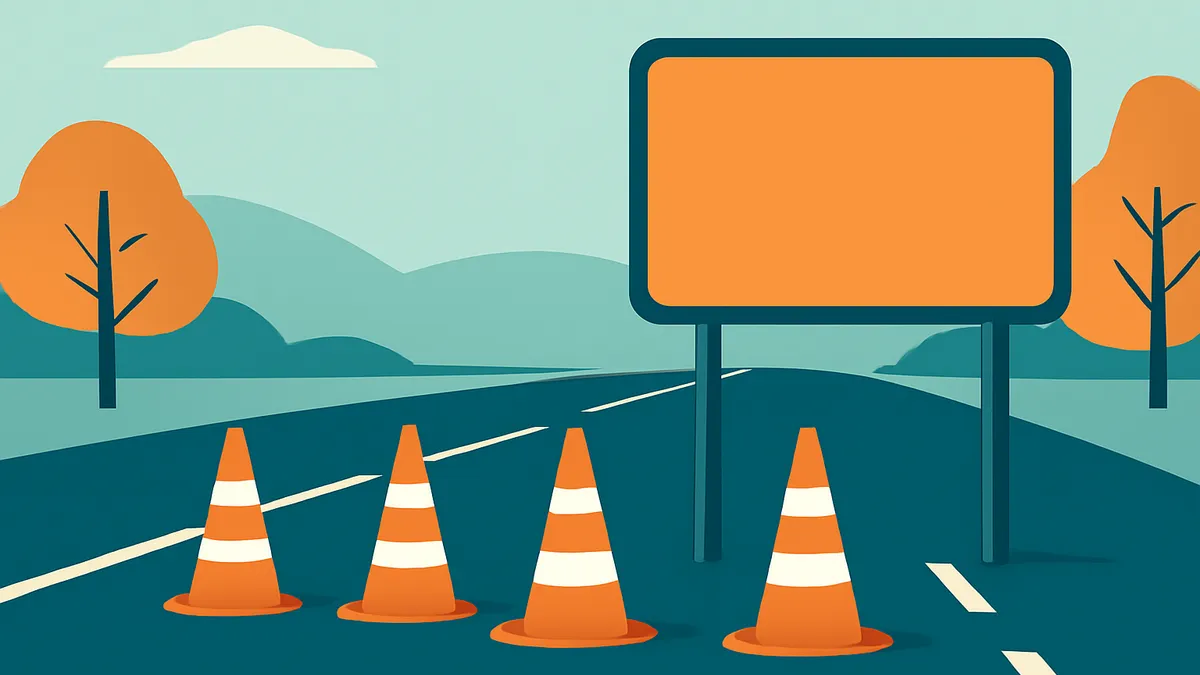 A highway scene with four orange traffic cones in the foreground and a large blank orange sign overhead