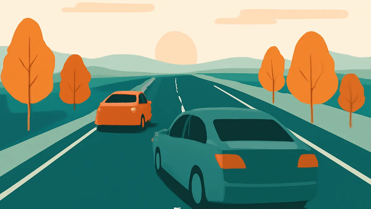 Two cars on a highway with trees on the side, under a sunset sky