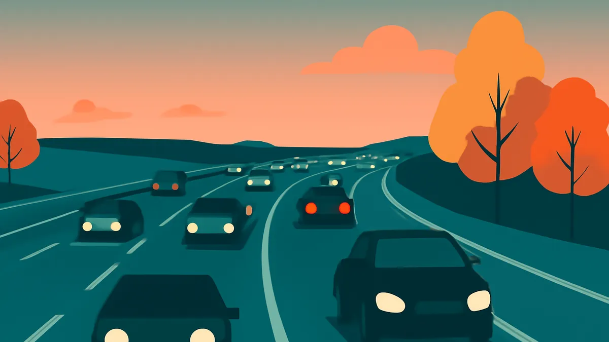 Cars on a highway at dusk with orange trees and sky