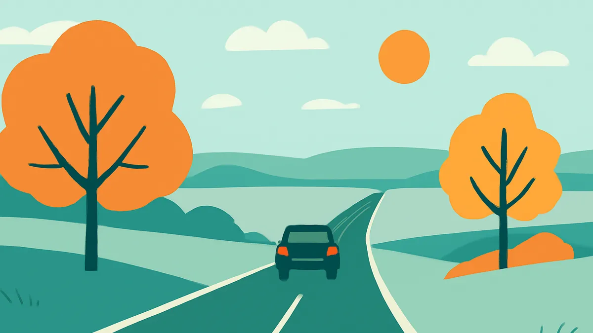 A car drives away on a two-lane road through a landscape with rolling hills and two trees with orange foliage