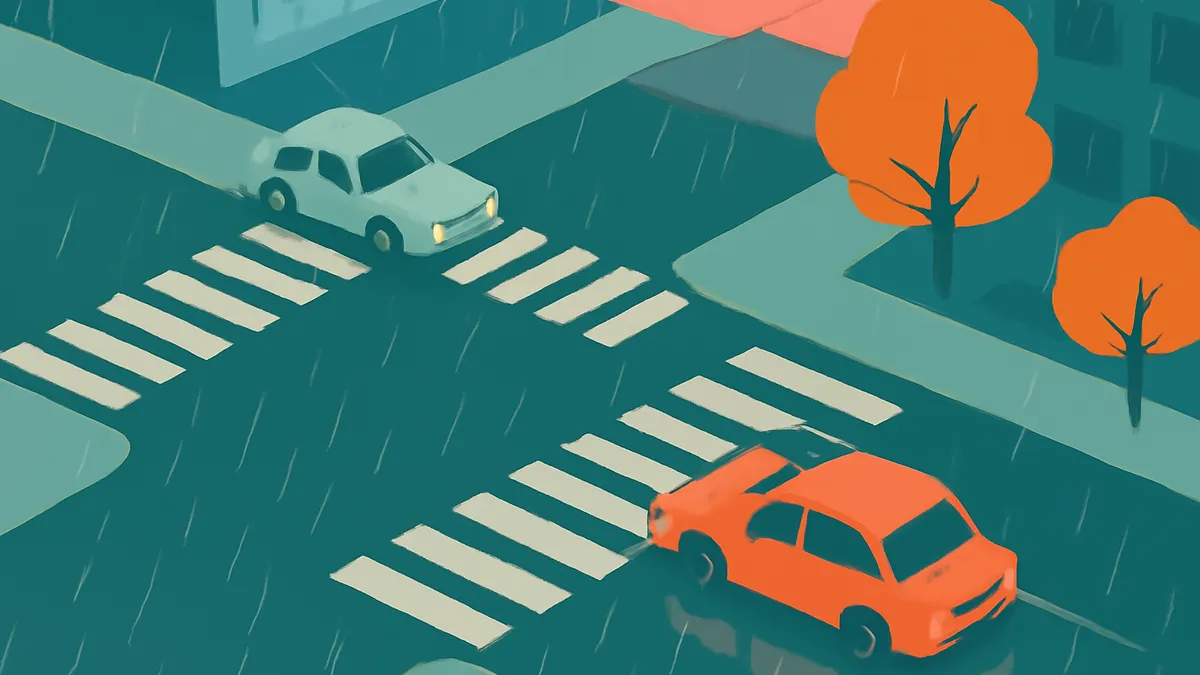 Two cars, one light blue and one orange, on a rainy street with crosswalks and trees