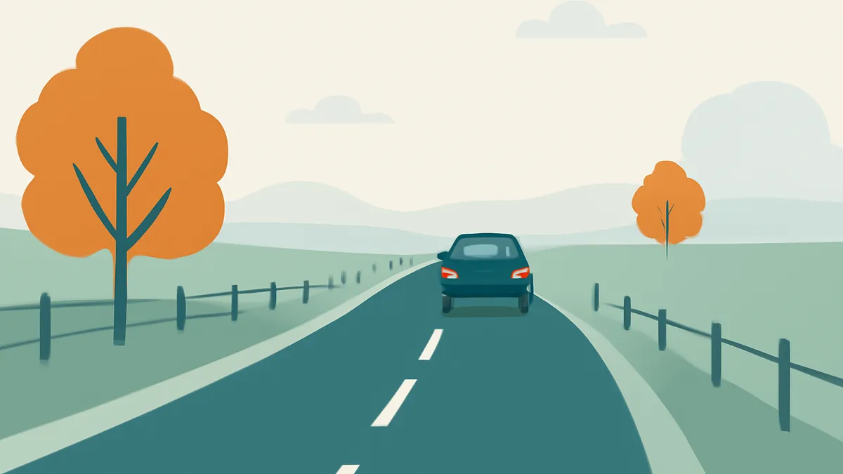 A dark blue car drives away on a two-lane road with a fence and orange trees on either side