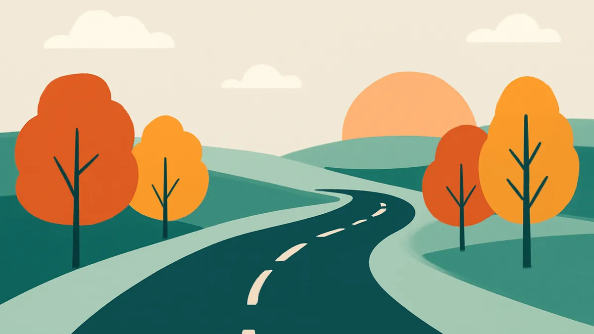 A winding road through rolling green hills with orange trees under a pale sky with a setting sun