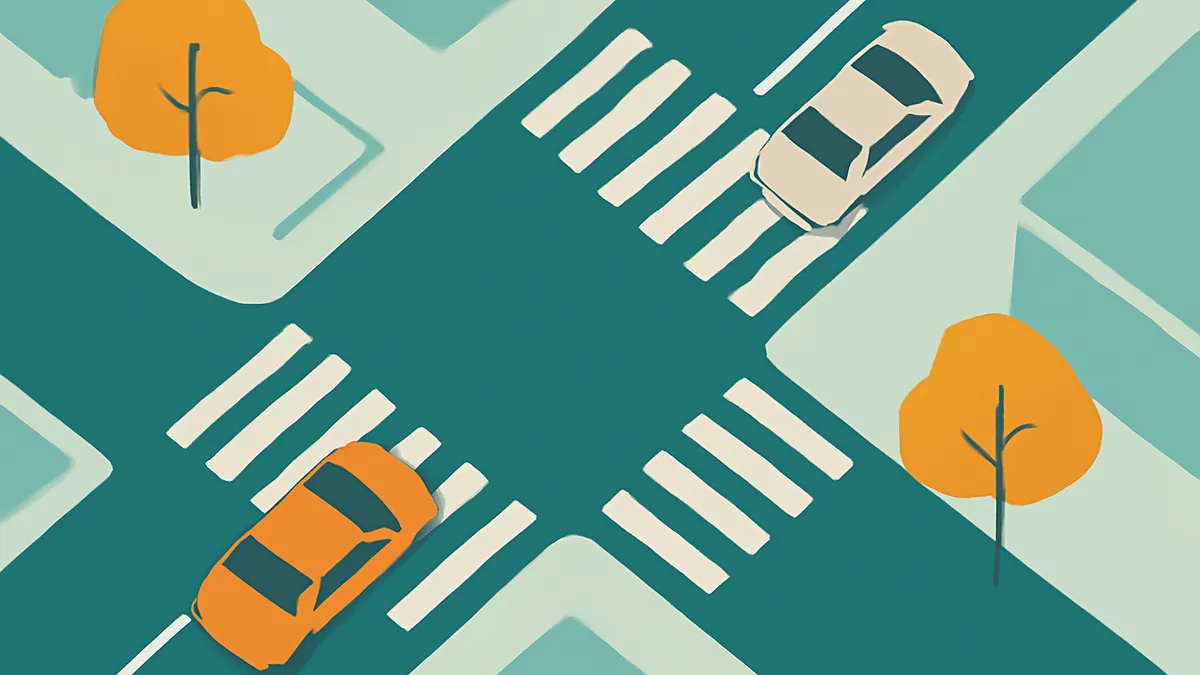An overhead view of a teal intersection with two cars, one orange and one white, and two orange trees